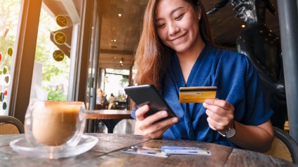 female using debit card